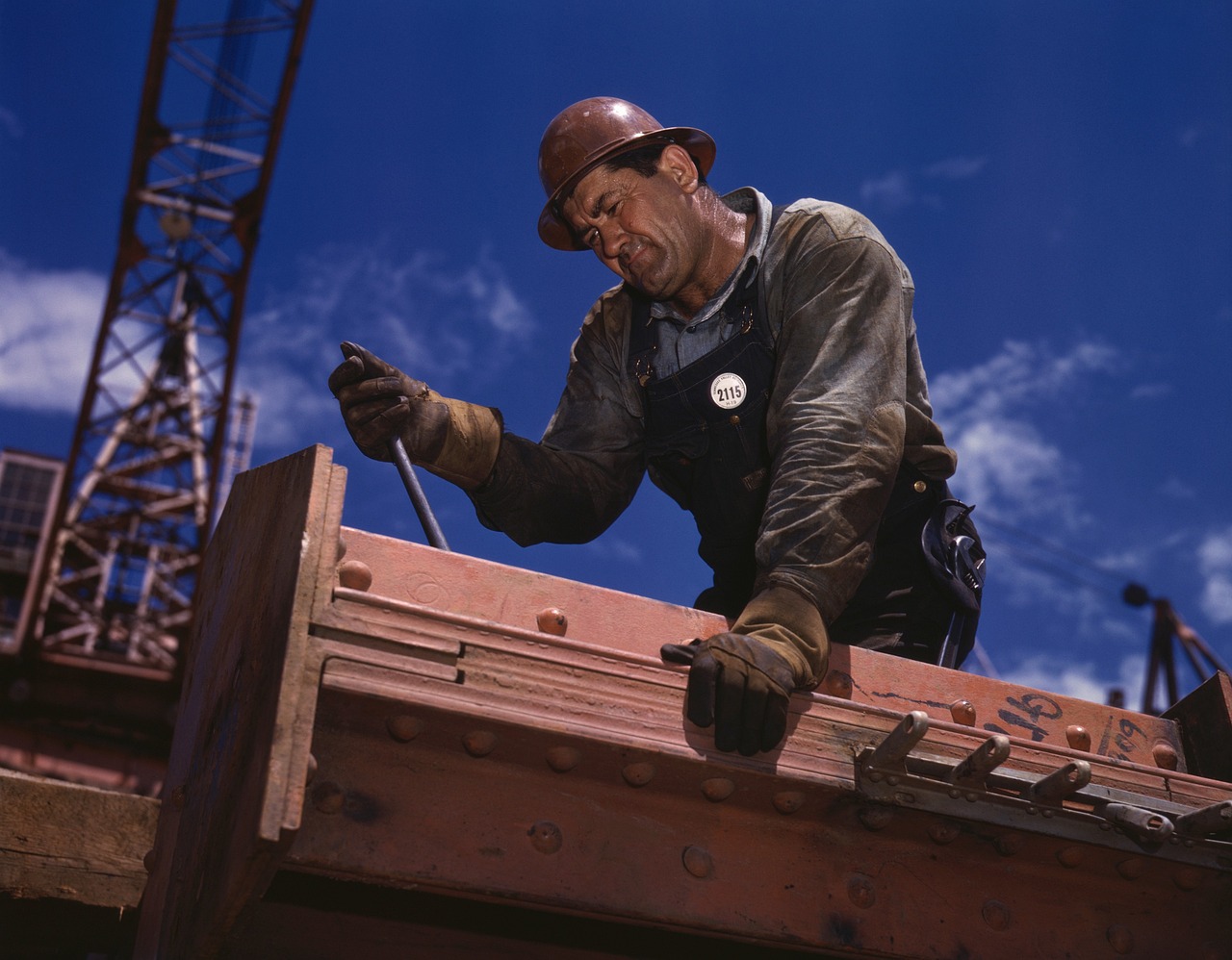 Technician inspecting mechanical equipment