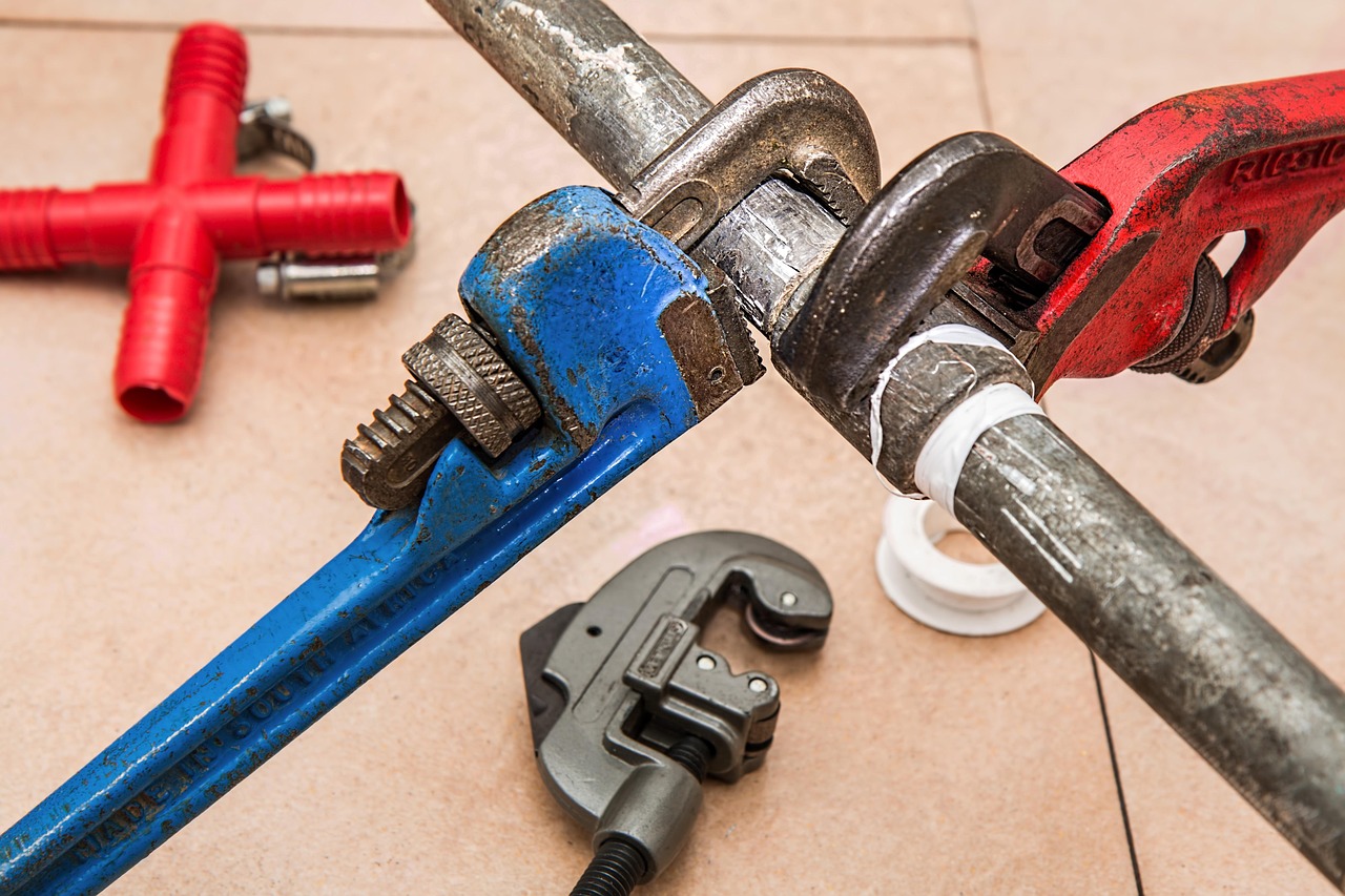 Contractor repairing pipes